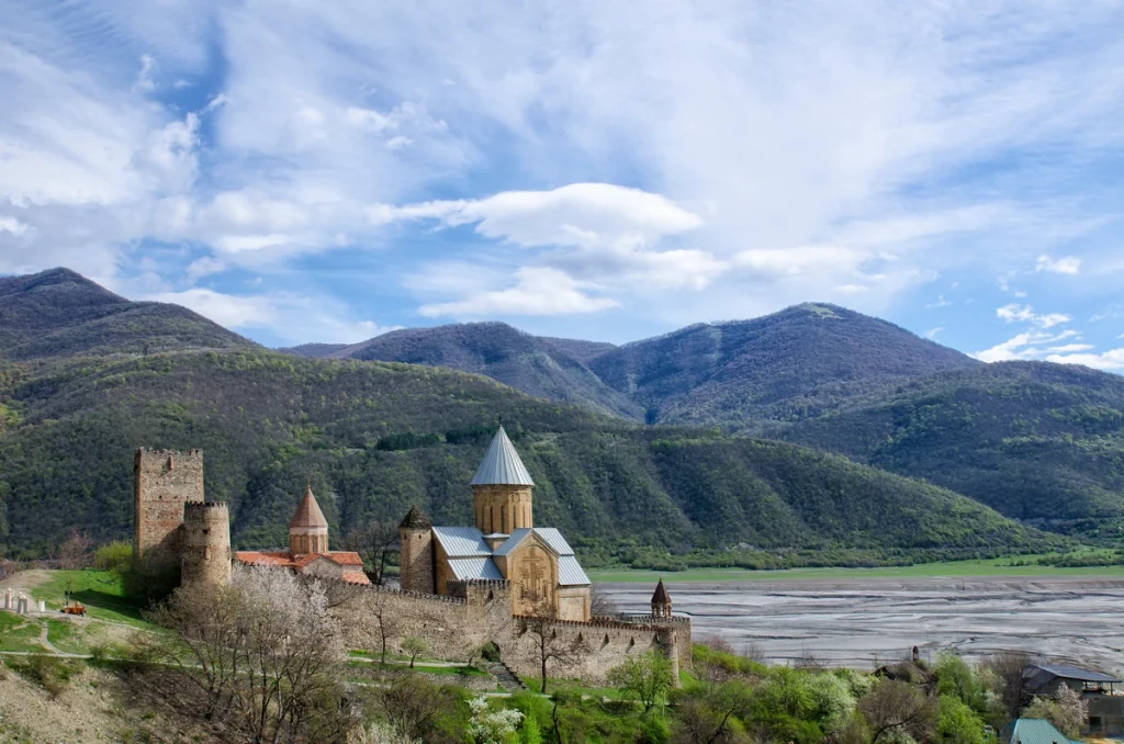 Ananuri-old-fortress-shore-against-backdrop-mountains